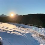 Im Schein der untergehenden Wintersonne zurück nach Obereggen