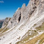 The trail winds along the rocky ravines to the Fonda Savio mountain hut