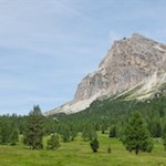 The meadows of Pian dei Menis are framed by Lagazuoi