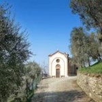 The 'Chiesetta San Siro' is located on a hill that offers a picturesque view of Lake Garda