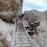 A sloping passage with a wooden staircase