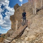 Wooden stairs facilitate the ascent to Passo del Vaiolon pass