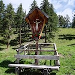 Cross and bench on the roadside