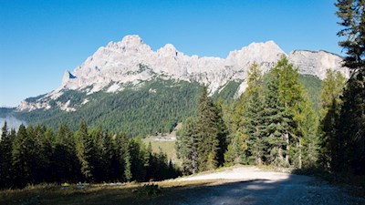 The ascent path is surrounded by towering Dolomites