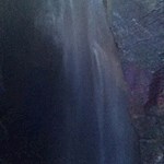 The fine water dust of the roaring Varone waterfall envelops the visitors