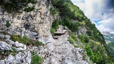 The path to Sorapis lake is secured with steel cables and metal stairs