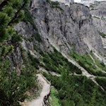 The jagged peaks of the mighty Three Peaks of Lavaredo are already towering overhead