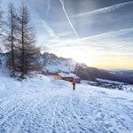 Die Wintersonne verabschiedet sich hinter dem Latemar