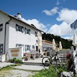 The sunny panoramic terrace of the Rifugio Chiusa mountain hut