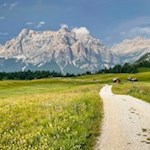 The Störes meadows are framed by towering Dolomites
