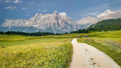 The Störes meadows are framed by towering Dolomites