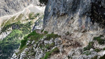 The path to Sorapis lake leads through rope-secured passages