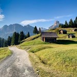 With a view of the Sas Ciampac peak and the Sassongher back to Corvara in Badia